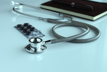 Doctor stethoscope for cardiac on blue tone and reflective background