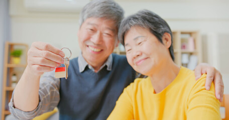 couple hold new house key