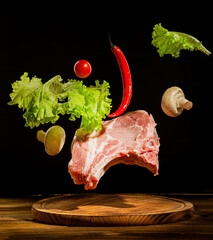 raw pork with salad and pepper