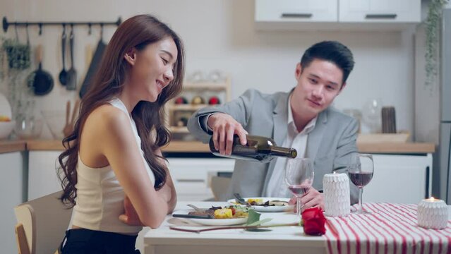 Asian young couple having dinner to celebrate valentine's day together