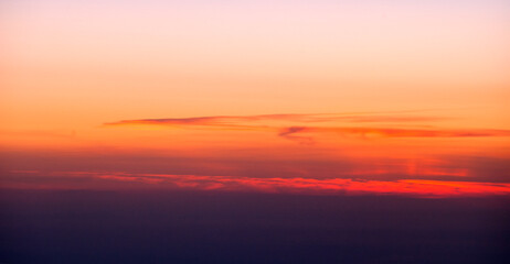 Naklejka na ściany i meble Picture the sunset on an airplane