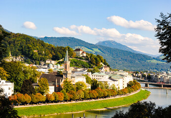 Fototapeta na wymiar Scenic view of part of Salzburg Austria, with the Protestant parish Salzburg Christ Church on Salzbach river in the center. 