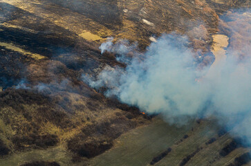 Agriculture fires during spring. Aerial view of some field fires in order to clean the fields for agriculture planting. Farming industry.  Air pollution.