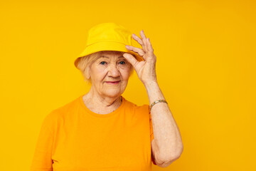 Portrait of an old friendly woman posing face grimace joy isolated background
