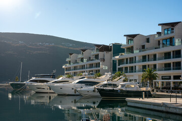 PortoNovi, Montenegro- January 24 2022: Landscape of the Portonovi Marina with luxury yachts and beautiful waterfront residences on the shores of Boka Bay