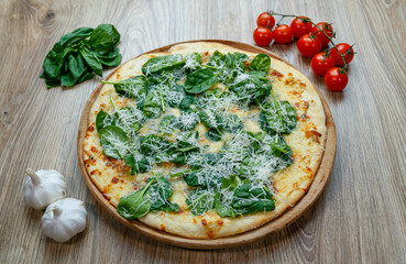 pizza with spinach and mozzarella extra shredded chessee