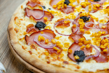 pizza with ham chesse onion corn and truffles