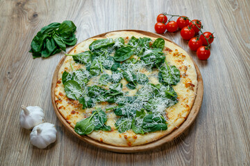 pizza with spinach and mozzarella extra shredded chessee