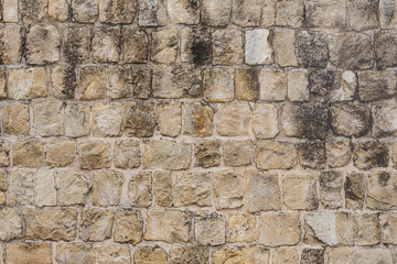 The texture of the stone wall. Background texture of the stone wall of the old castle.