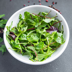 salad leaves mix arugula, spinach, lettuce, frise, radicchio, mung bean salad fresh dietary healthy meal diet still life snack on the table copy space food background vegan or vegetarian food