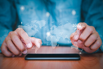 Businessman uses a smartphone to business analysing with financial graph data. Business finance background. business finance technology, business finance technology and investment concept