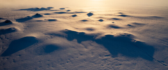 Beautiful shadow and light shapes on a snow in winter