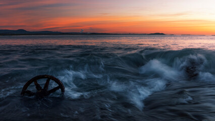 antique wheel in the ocean at windang island in nsw