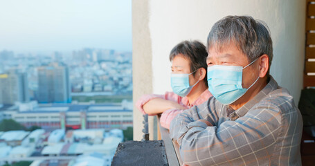 senior couple looking outside