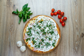 pizza with ham, sour cream, mozarella and dill