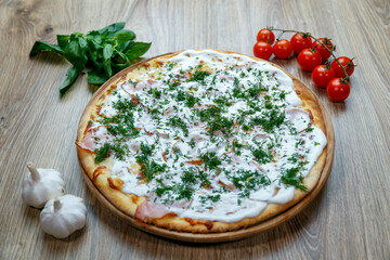 pizza with ham, sour cream, mozarella and dill