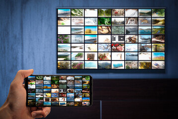 Television streaming, TV broadcast. Television streaming video concept. Media TV video on demand technology. Phone and TV with same image on screens. cross-platform