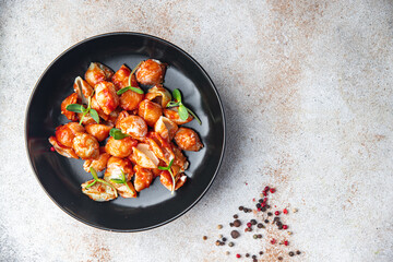 conchiglie pasta shells tomato sauce second course fresh portion dietary healthy meal food diet still life snack on the table copy space food background rustic top view