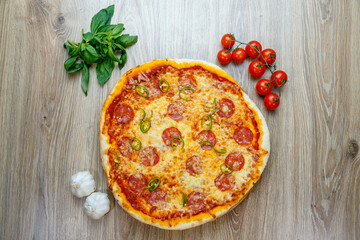 pizza with salami, mozarella, green hot pepper