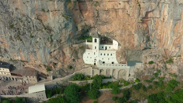Aerial view on the Monastery of Ostrog situated vertical rocky mountain. It is dedicated to Saint Basil of Ostrog.