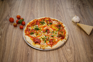 pizza with salami mozzarella red pepper corn dill and tomato sauce