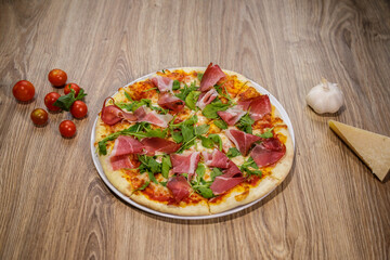 pizza with prosciutto crudo and spinach