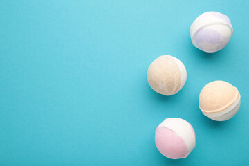 Flat lay composition with bath bombs on blue background