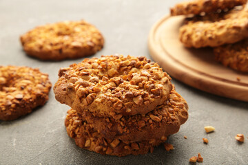 Peanut cookies on cutting board on grey background. Bakery products.