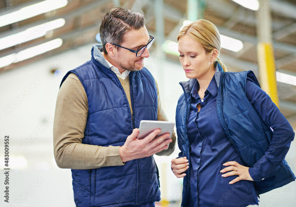 Aufkleber We need this order tracked. Shot of two people using a digital tablet while working in a warehouse.