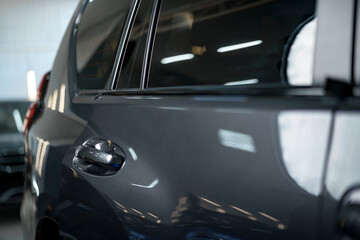 Fototapeta premium A view of dark gray car rear door and window