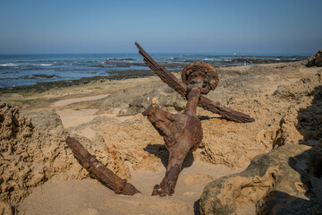 ancient anchor on the beach