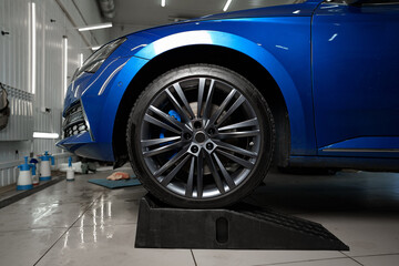 Front wheel of modern blue sport car