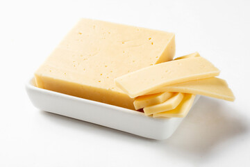 Russian cheese slicing on a white background for insulation. Classic cheese