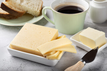 Breakfast with a sandwich on a light background. Coffee with a sandwich. Cheese for breakfast