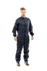 Naklejka premium A middle-aged white man wearing a black raincoat standing over isolated white background looks happy. Worker concept.