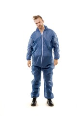 Fototapeta premium A middle-aged white man blue wearing overalls for paintwork standing over isolated white background looks happy. Worker and builder concept.