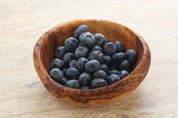 Sweet ripe blueberry heap in the bowl