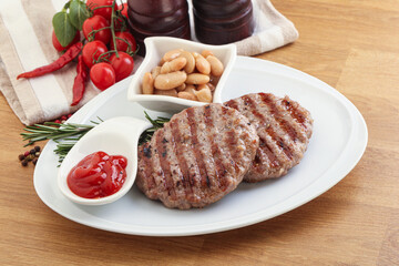 Grilled beef burger cutlet with sauce