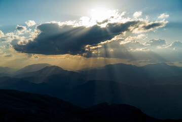 clouds, sunshine and mountains