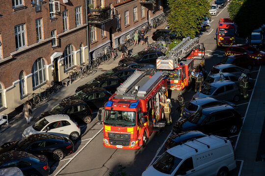 Copenhagen, Denmark - September 01, 2021: High angle view of fire trucks parked in a street.