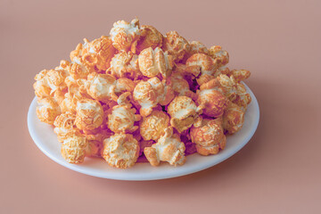 A bunch of cheddar cheese flavored crackles on a plate