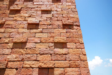 Fototapeta na wymiar Brick wall and blue sky