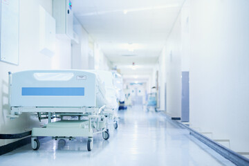 Where healing happens. Shot of a hospital bed in an empty corridor of a modern hospital.