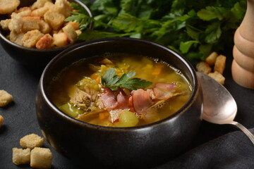 Lentil pea soup garnish with bacon, fried onion and croutons