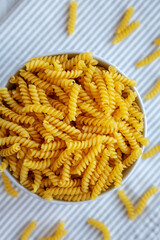 Raw Dry Organic Rotini Pasta Ready to Cook. Top view, from above, flat lay.