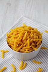 Raw Dry Organic Rotini Pasta Ready to Cook, side view.