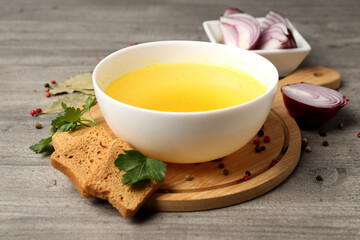 Concept of tasty food with broth on gray wooden background