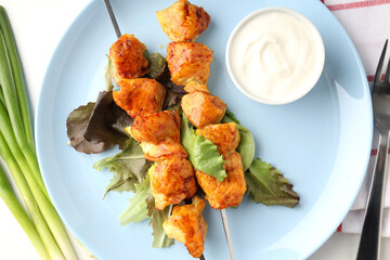 Concept of tasty food with chicken shashlik on white background