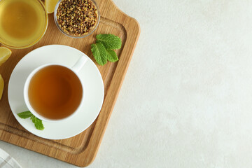 Obraz na płótnie Canvas Concept of hot drink with buckwheat tea on light textured table