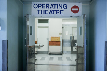 Open for surgery. Shot of open doors leading to an operating room in a hospital.